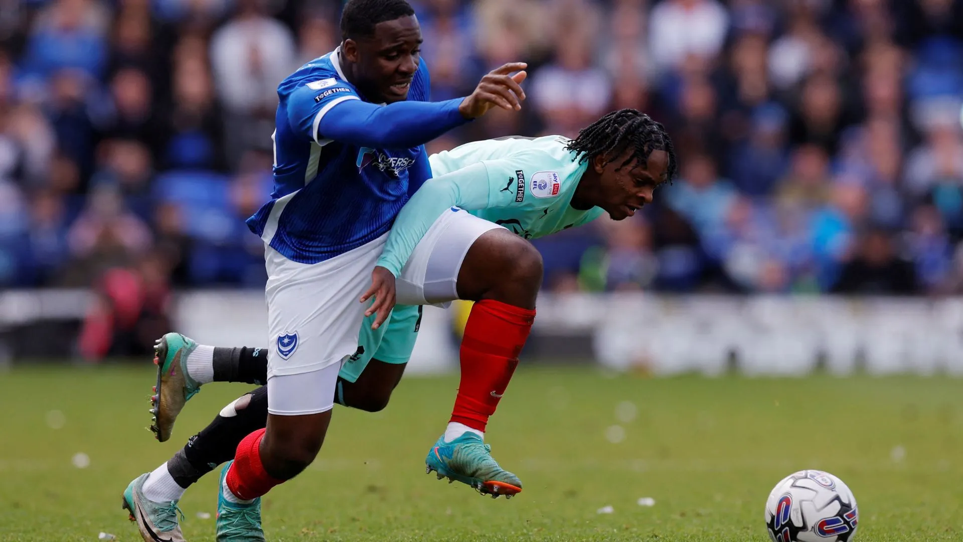 Christian Saydee trong màu áo Portsmouth trước khi chuyển đến Wigan